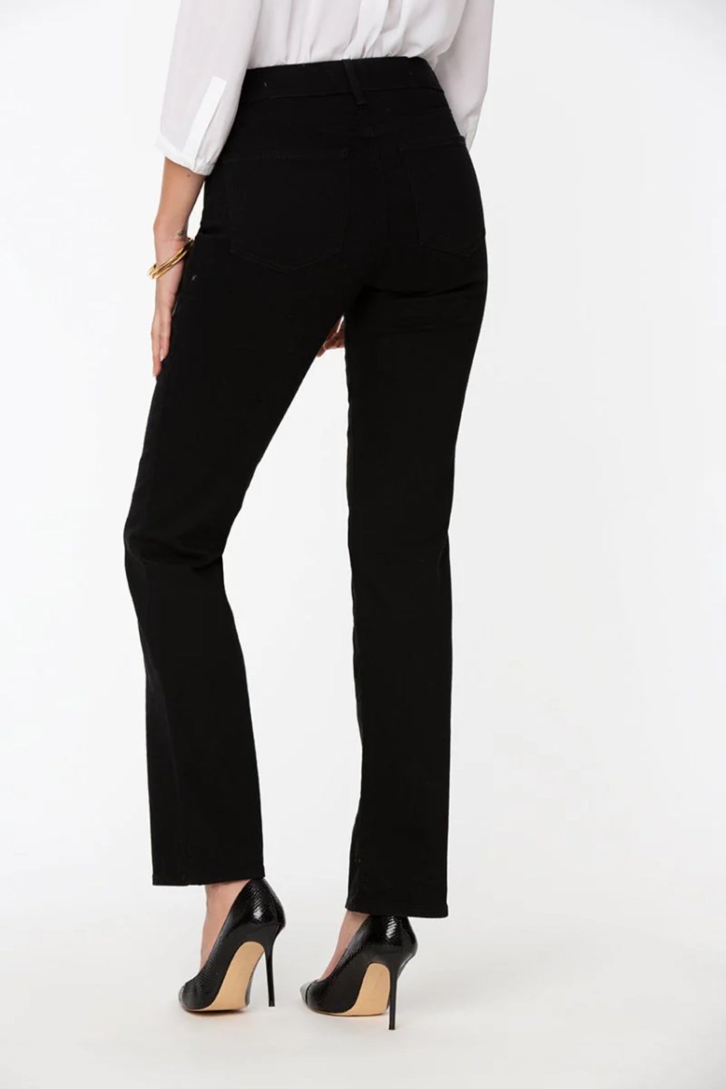 Back view of woman wearing NYDJ Marilyn Straight Black Jeans 30” by NYDJ, shop the NYDJ collection at Dotique.