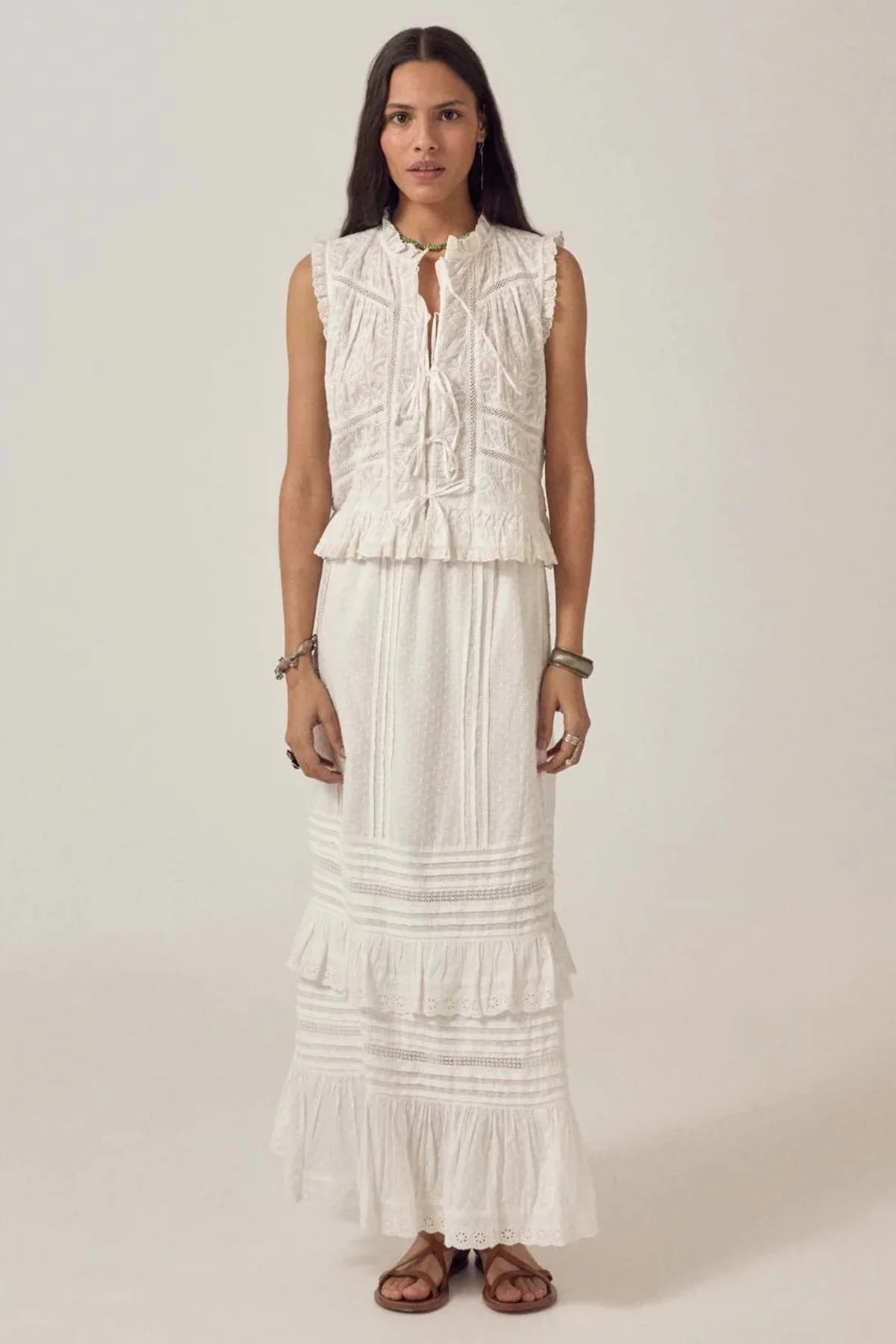 Woman wearing Maison Hotel Allegra Skirt Ponza Moonstone in white by Maison Hotel, shop Maison Hotel at Dotique