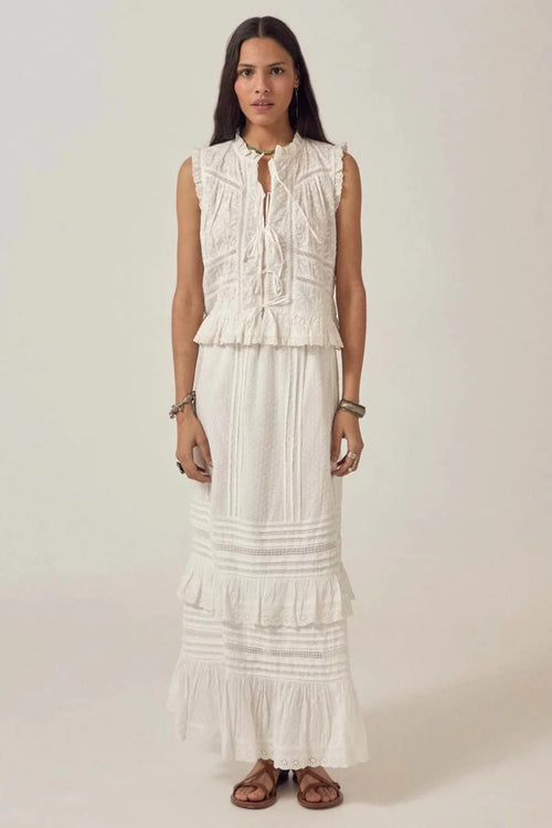 Woman wearing Maison Hotel Allegra Skirt Ponza Moonstone in white by Maison Hotel, shop Maison Hotel at Dotique