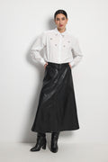 Shop the Tinta 4040455 Jacobella Women's Skirt in Black at Dotique. A timeless faux leather midi skirt with a flattering A-line shape and button-through front, perfect for effortless everyday styling.