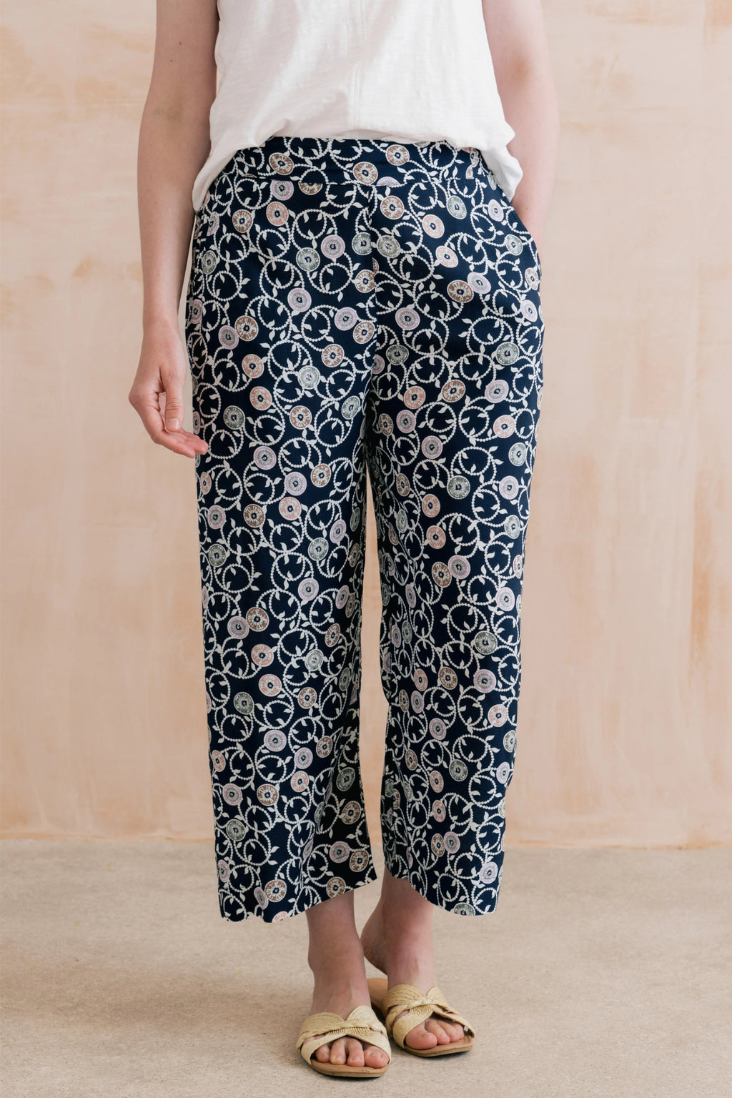 Woman wearing Lily & Me LM26023 Greta Trousers Sea Holly Navy with floral print and straight leg by Lily & me. Shop Lily & me at Dotique.