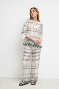 Model wearing Bariloche 3943902 Lodosa Shirt by bariloche, shop bariloche at Dotique in a patterned white and black design