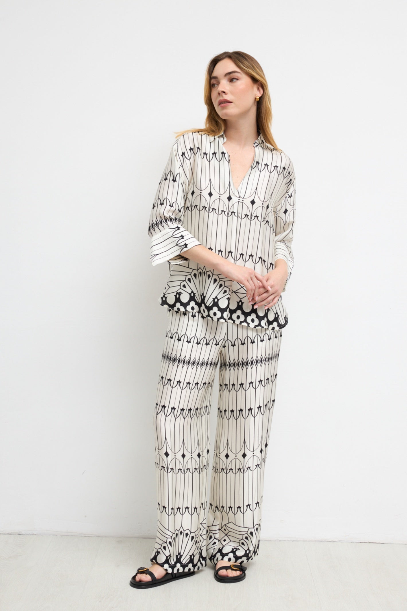 Model wearing Bariloche 3943902 Lodosa Shirt by bariloche, shop bariloche at Dotique in a patterned white and black design