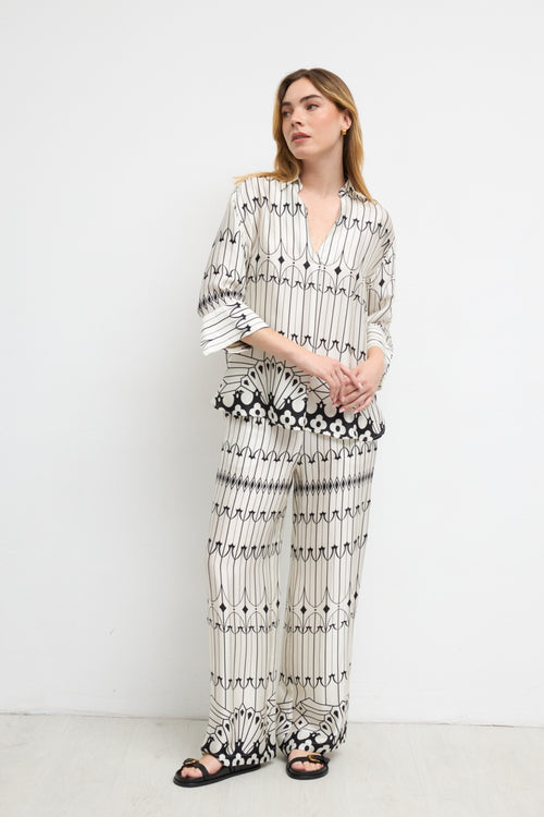 Model wearing Bariloche 3943902 Lodosa Shirt by bariloche, shop bariloche at Dotique in a patterned white and black design