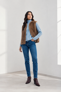 Shop the MICHA Brown Faux Fur Gilet at Dotique. A soft, textured sleeveless layer in a warm brown, perfect worn over knitwear, shirts and dresses.