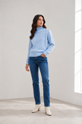 Shop the MICHA Pale Blue High Neck Jumper at Dotique. A soft blue women's knit with ribbed neckline, subtle flecked detail and statement shoulder buttons.