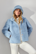 Shop the MICHA Pale Blue Faux Fur Jacket at Dotique. A beautifully soft short winter jacket in pale blue with a cosy high collar and panelled finish.