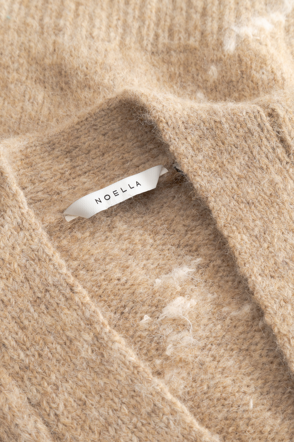 The Noella N-Laiana Knit Cardigan in Sand Melange is a beautiful example of this season's Highland Romance trend. Shop Noella at Dotique.