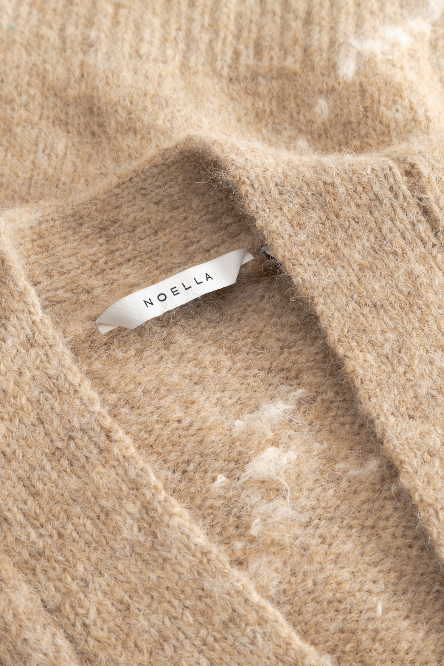 The Noella N-Laiana Knit Cardigan in Sand Melange is a beautiful example of this season's Highland Romance trend. Shop Noella at Dotique.