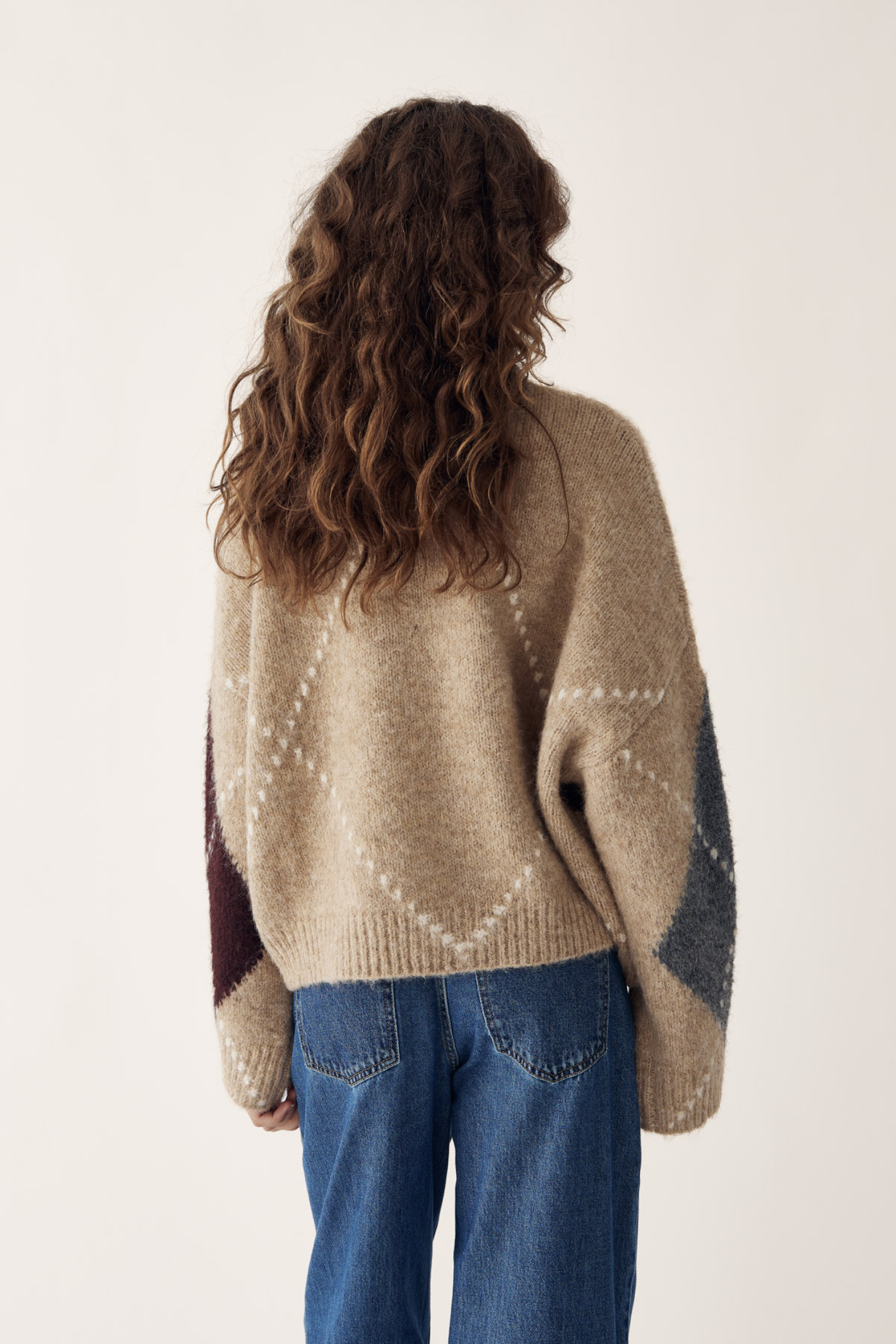 The Noella N-Laiana Knit Cardigan in Sand Melange is a beautiful example of this season's Highland Romance trend. Shop Noella at Dotique.