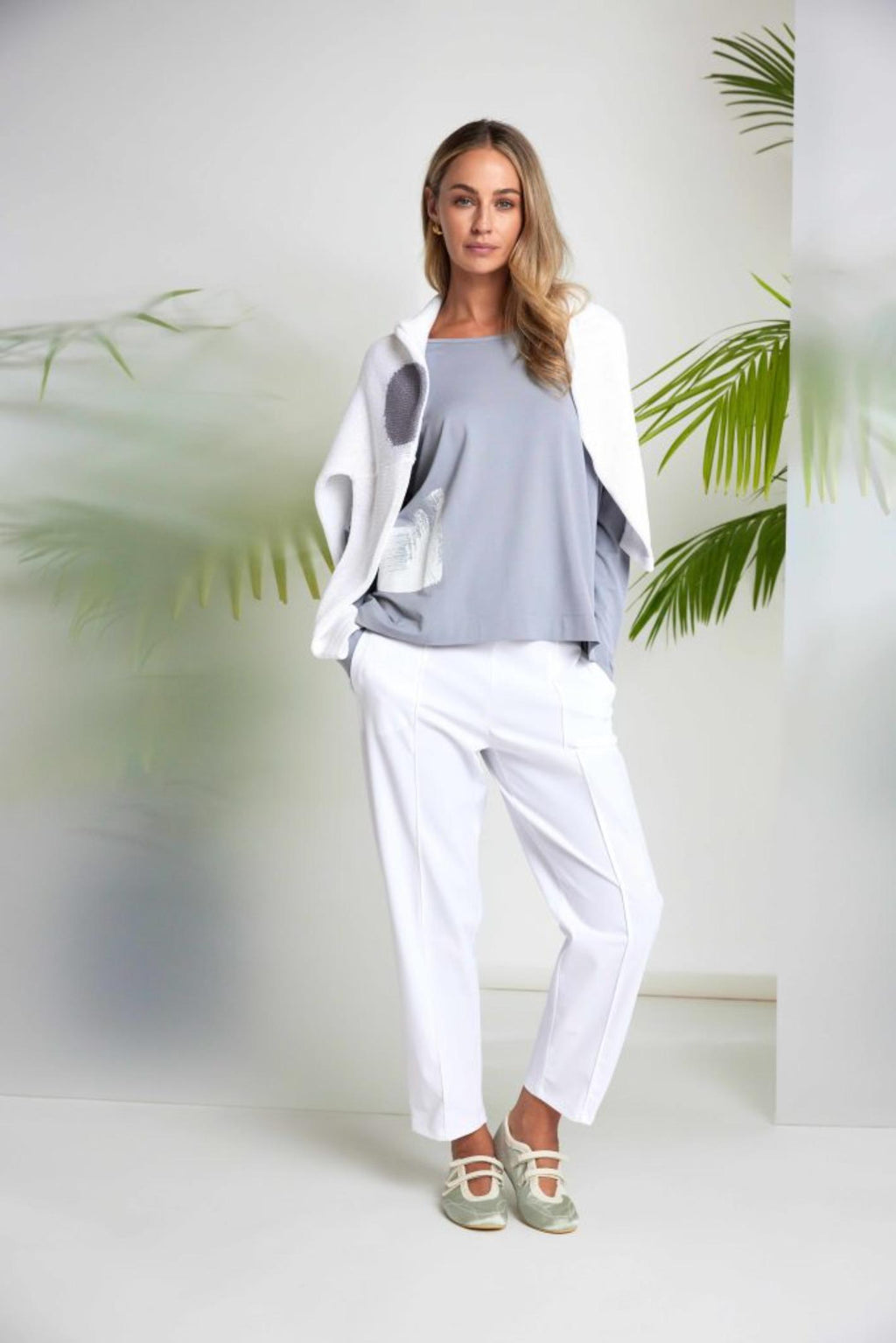 Woman wearing Naya NAS26143 Dove Grey White Print Top by Naya styled with white pants Shop Naya at Dotique