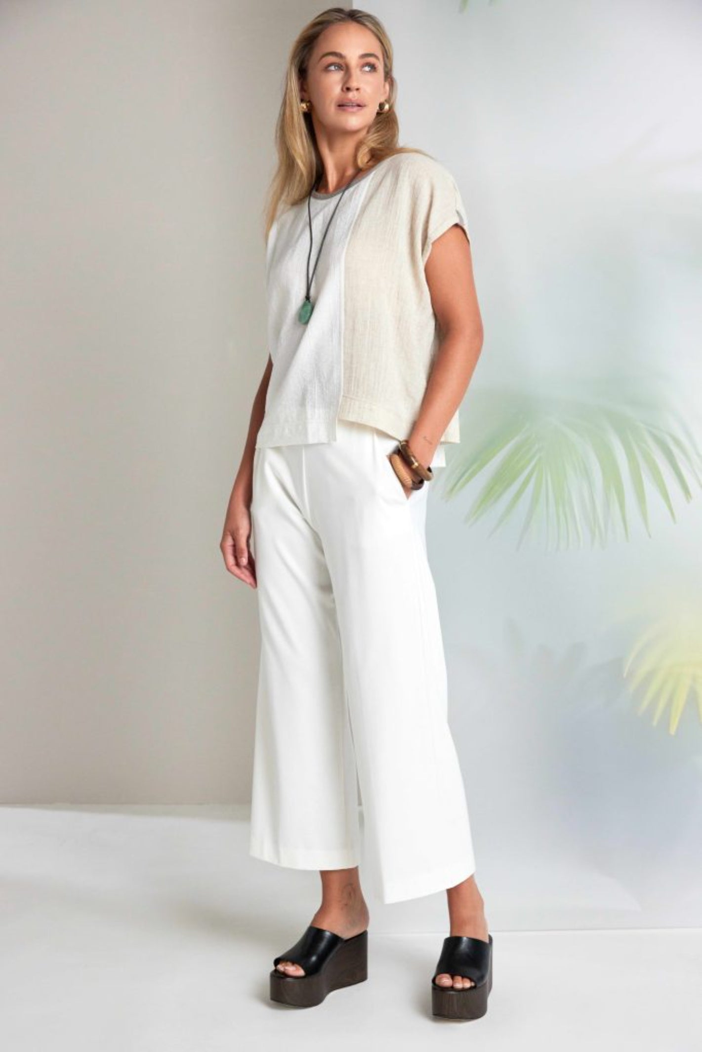 Naya NAS26237 White Wide Leg Pull-On Trousers by Naya styled on model, shop Naya at Dotique for modern elegance