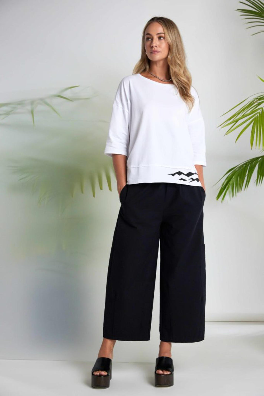 Model wearing Naya NAS26260 Black Balloon Shape Trousers by Naya, shop Naya at Dotique for modern volume style