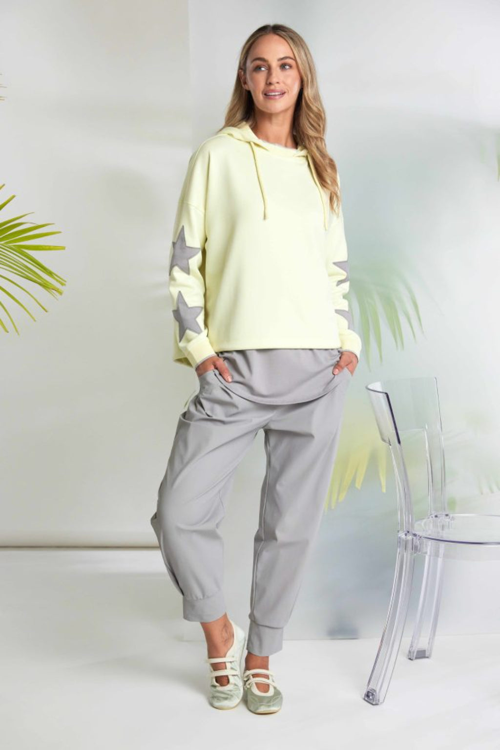 Naya NAS26214 Lemon Star Sleeve Hooded Top With Contrast Cuffs by Naya modeled with relaxed pants Shop Naya at Dotique
