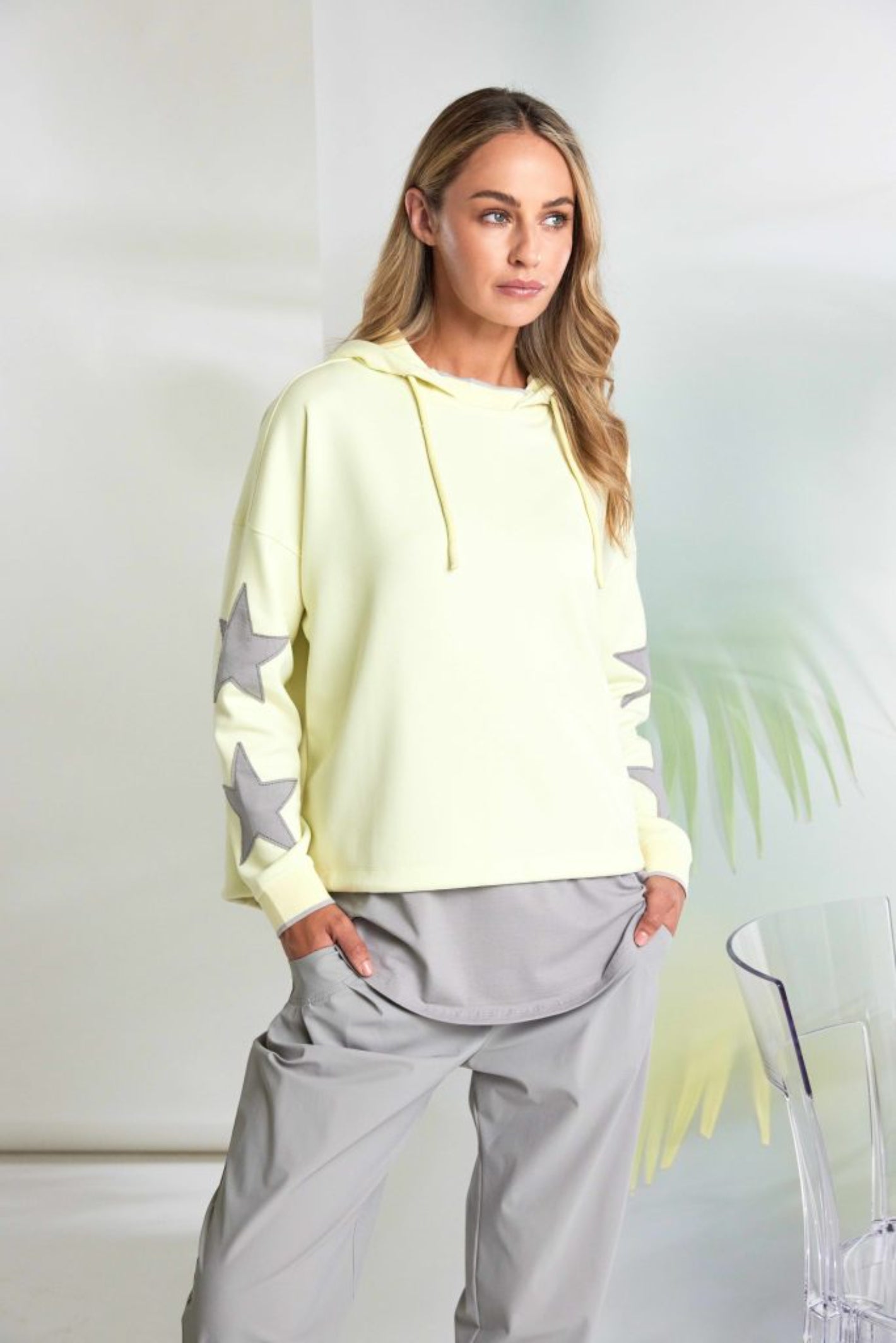 Woman wearing Naya NAS26214 Lemon Star Sleeve Hooded Top With Contrast Cuffs by Naya Shop Naya at Dotique