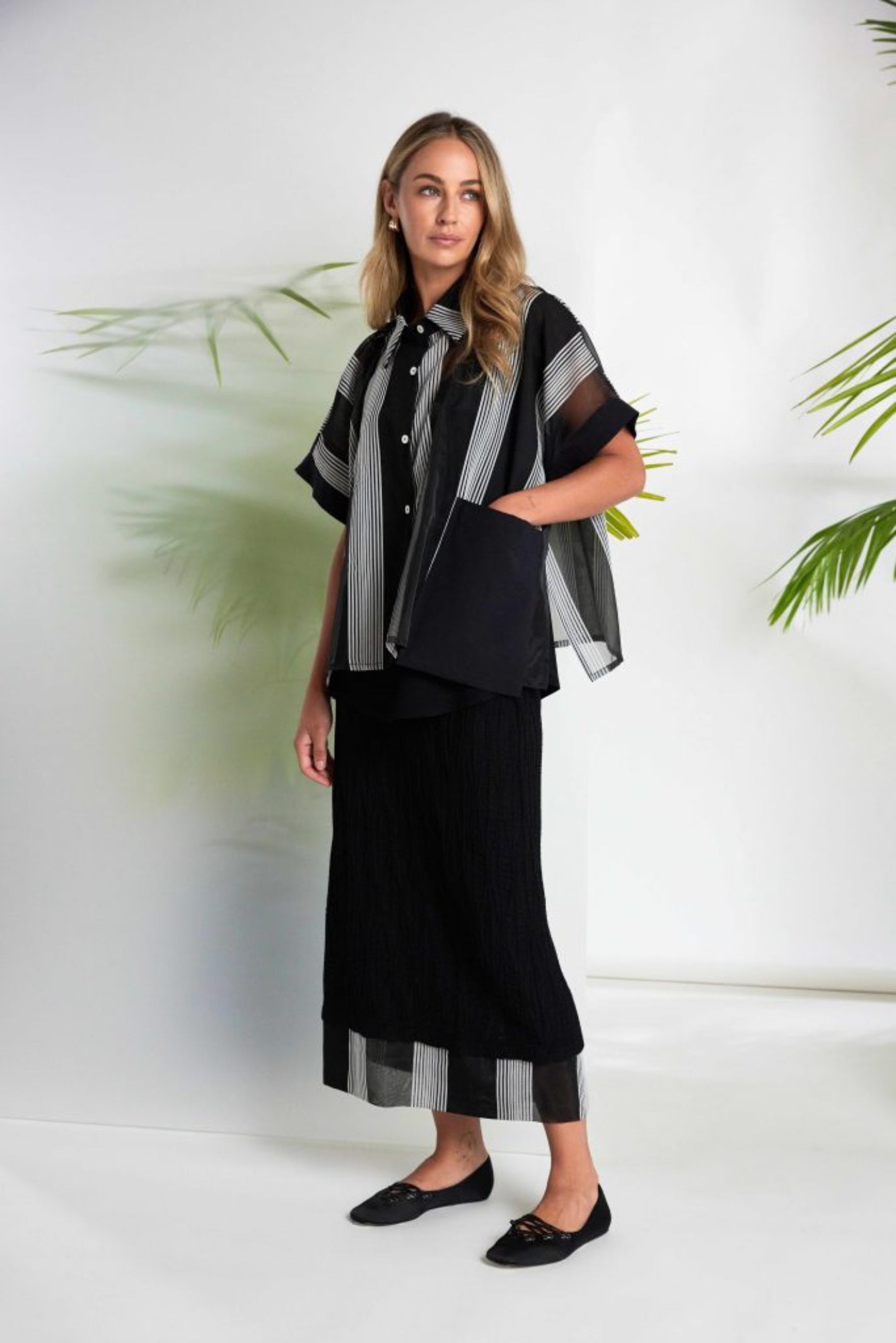 Model wearing Naya NAS26258 Embossed Pull-On Midi Skirt with Stripe Hem by Naya available to shop at Dotique