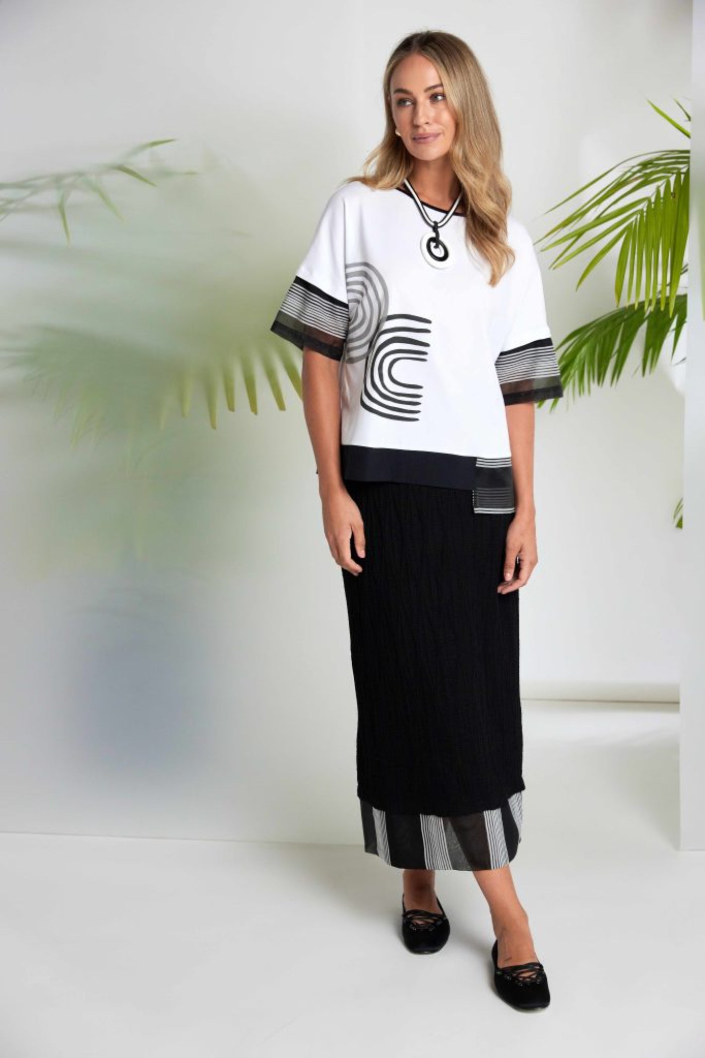 Naya NAS26258 Embossed Pull-On Midi Skirt with Stripe Hem by Naya styled on model Shop Naya at Dotique