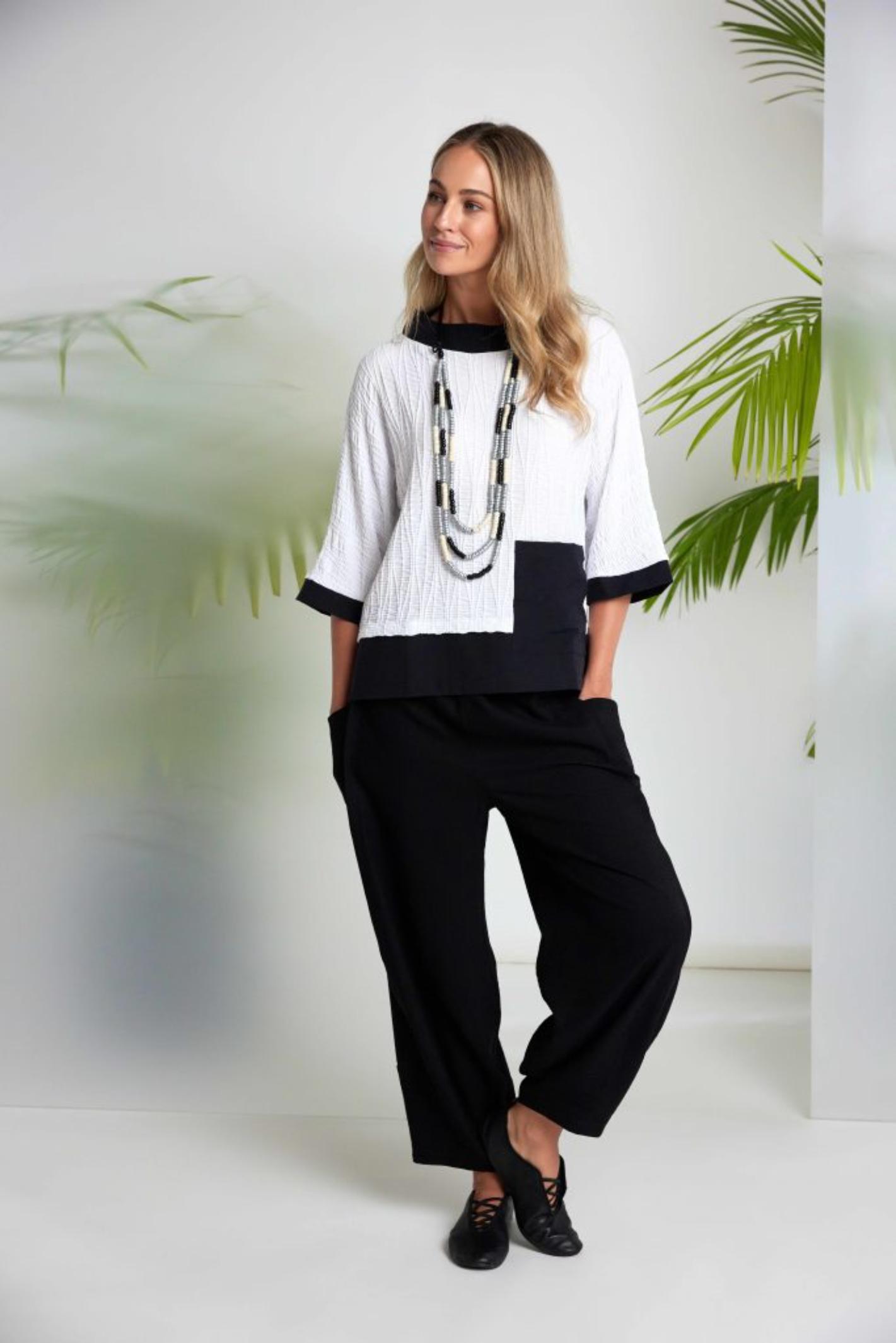 Naya NAS26264 White Black Embossed Jacquard Top by Naya modeled with black pants Shop Naya at Dotique