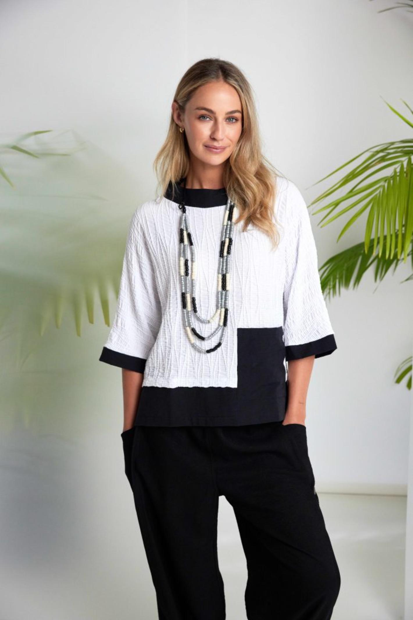 Naya NAS26264 White Black Embossed Jacquard Top by Naya, shop this stylish top at Dotique for elegant textured fashion.