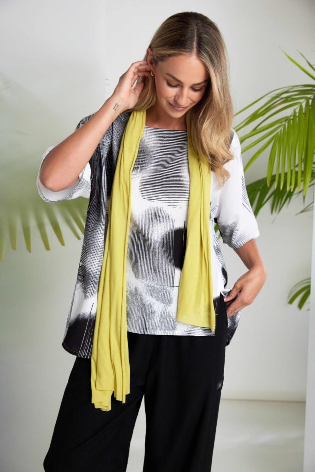 Naya NAS26311 Blurred Spot Print Square Tunic Top – White & Black worn by model, shop Naya at Dotique for stylish tops.