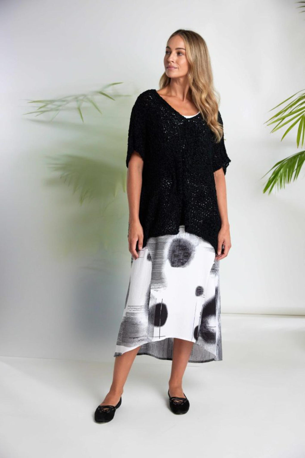 Model wearing Naya NAS26312 Blurred Spot Print Sleeveless Dress – White & Black by Naya Shop Naya at Dotique