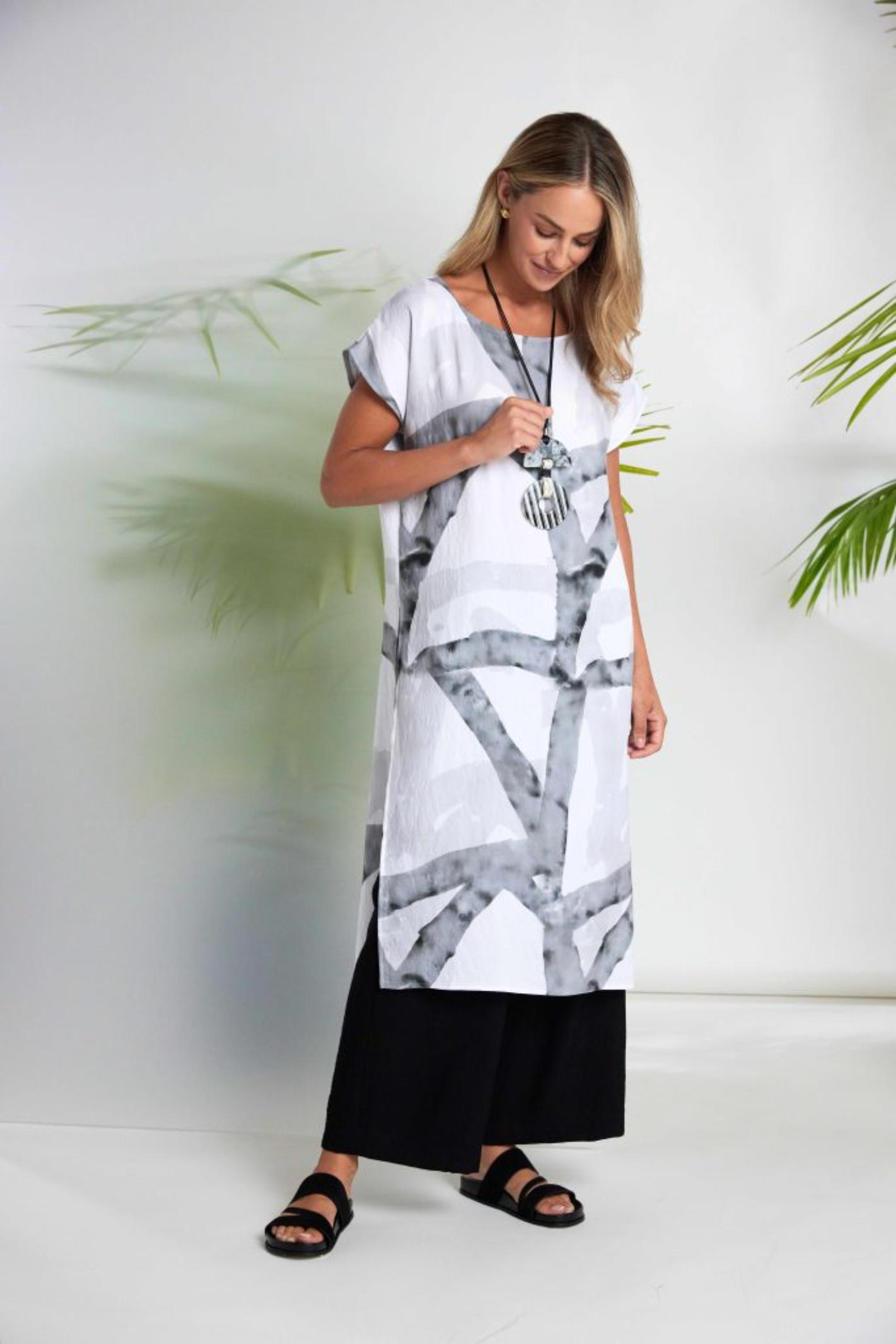 Woman wearing Naya NAS26313 Marbled Ribbon Print Round Neck Dress – White & Grey by Naya Shop the vendor at Dotique