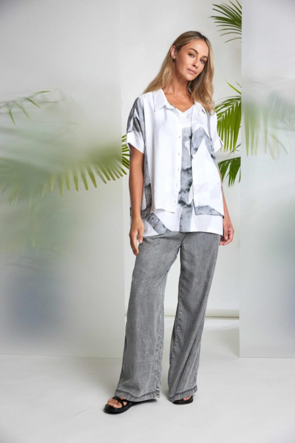 Woman modeling Naya NAS26314 Marbled Ribbon Print V-Neck Top – White & Grey by Naya Shop Naya at Dotique