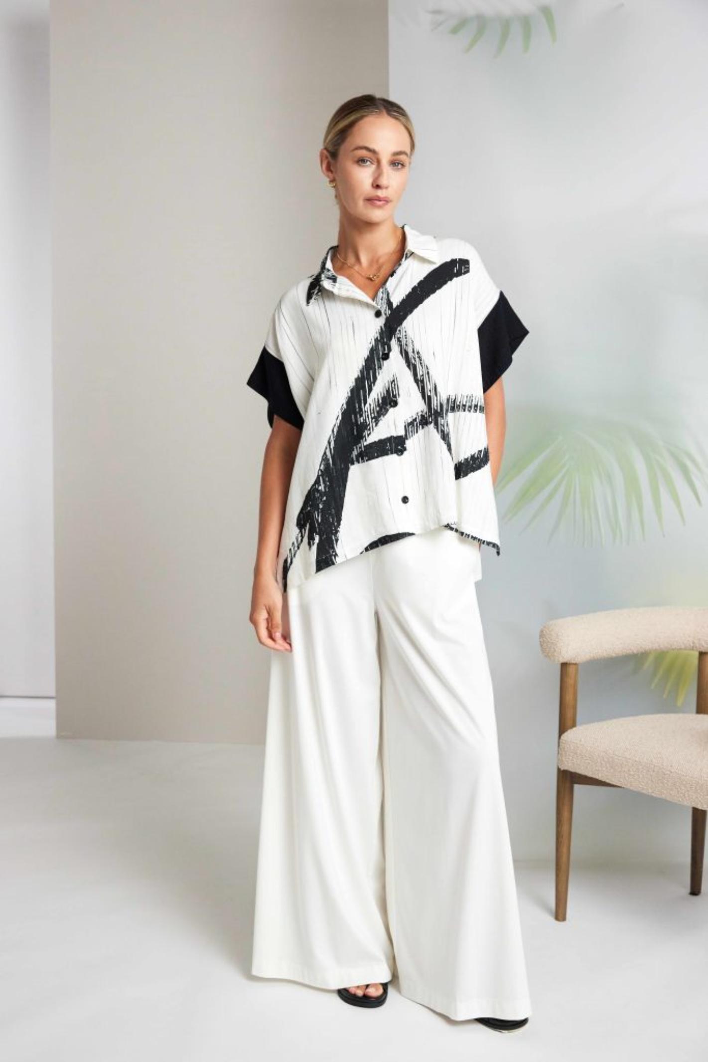 Model wearing Naya NAS26318 Brush Stroke Print Blouse with Contrast Cuff – Cream & Black by Naya Shop Naya at Dotique