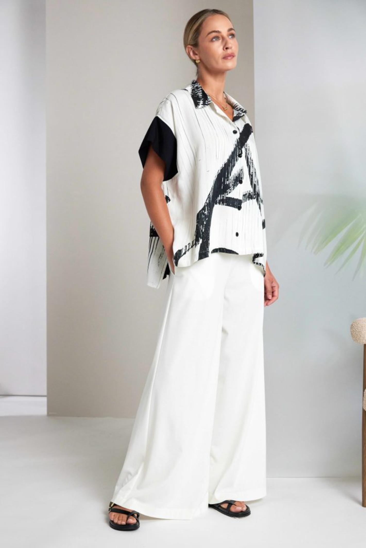 Naya NAS26318 Brush Stroke Print Blouse with Contrast Cuff – Cream & Black by Naya shop at Dotique styled with white wide pants and sandals