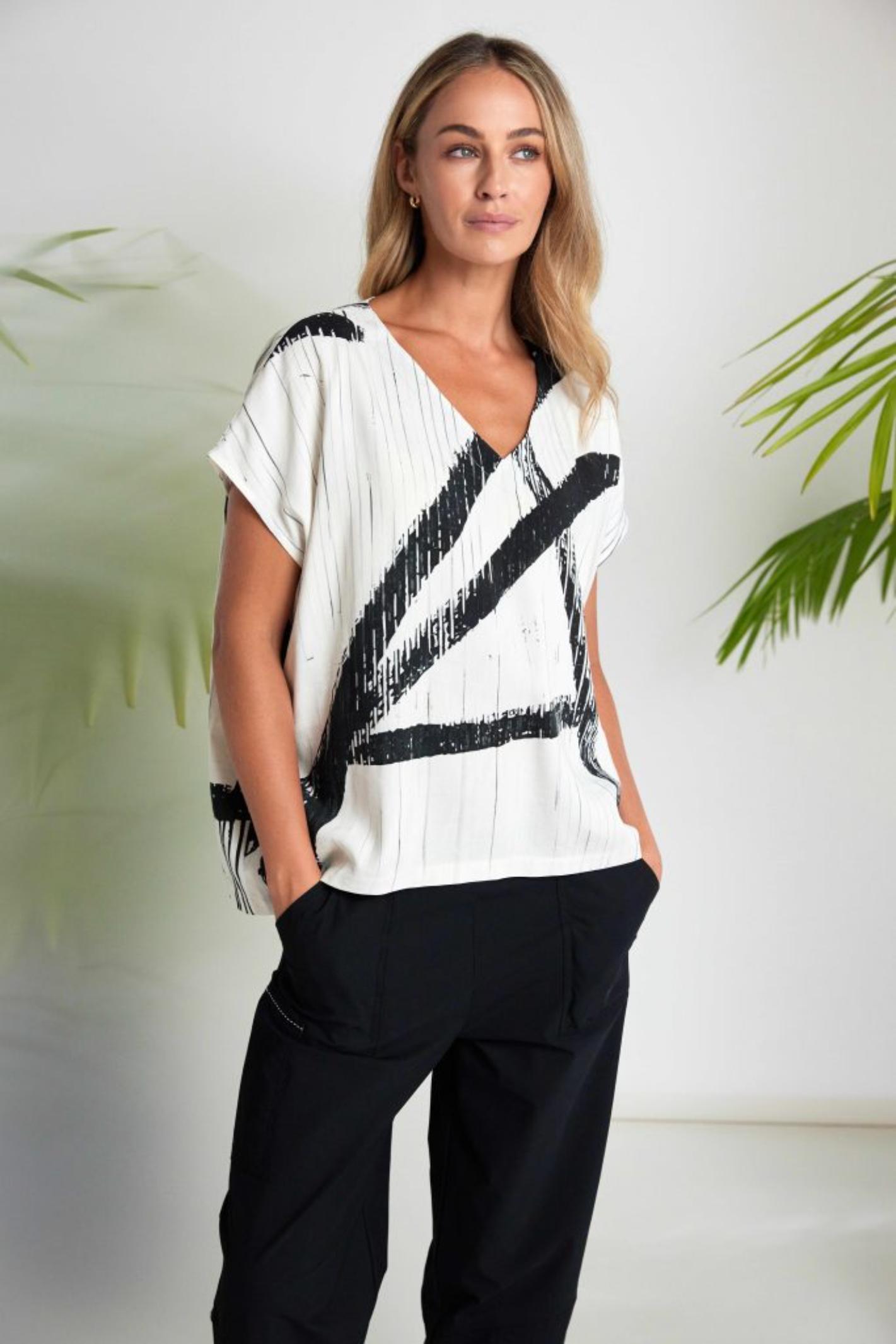 Model wearing Naya NAS26319 Cream Black Brush Stroke V-Neck Top by Naya Shop the Naya range at Dotique