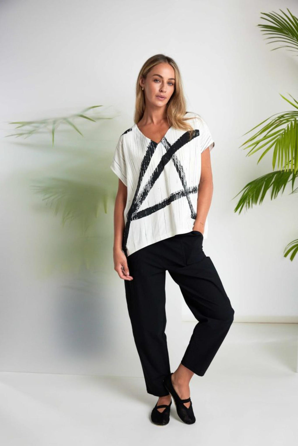 Woman wearing Naya NAS26319 Cream Black Brush Stroke V-Neck Top by Naya, shop the Naya collection at Dotique.