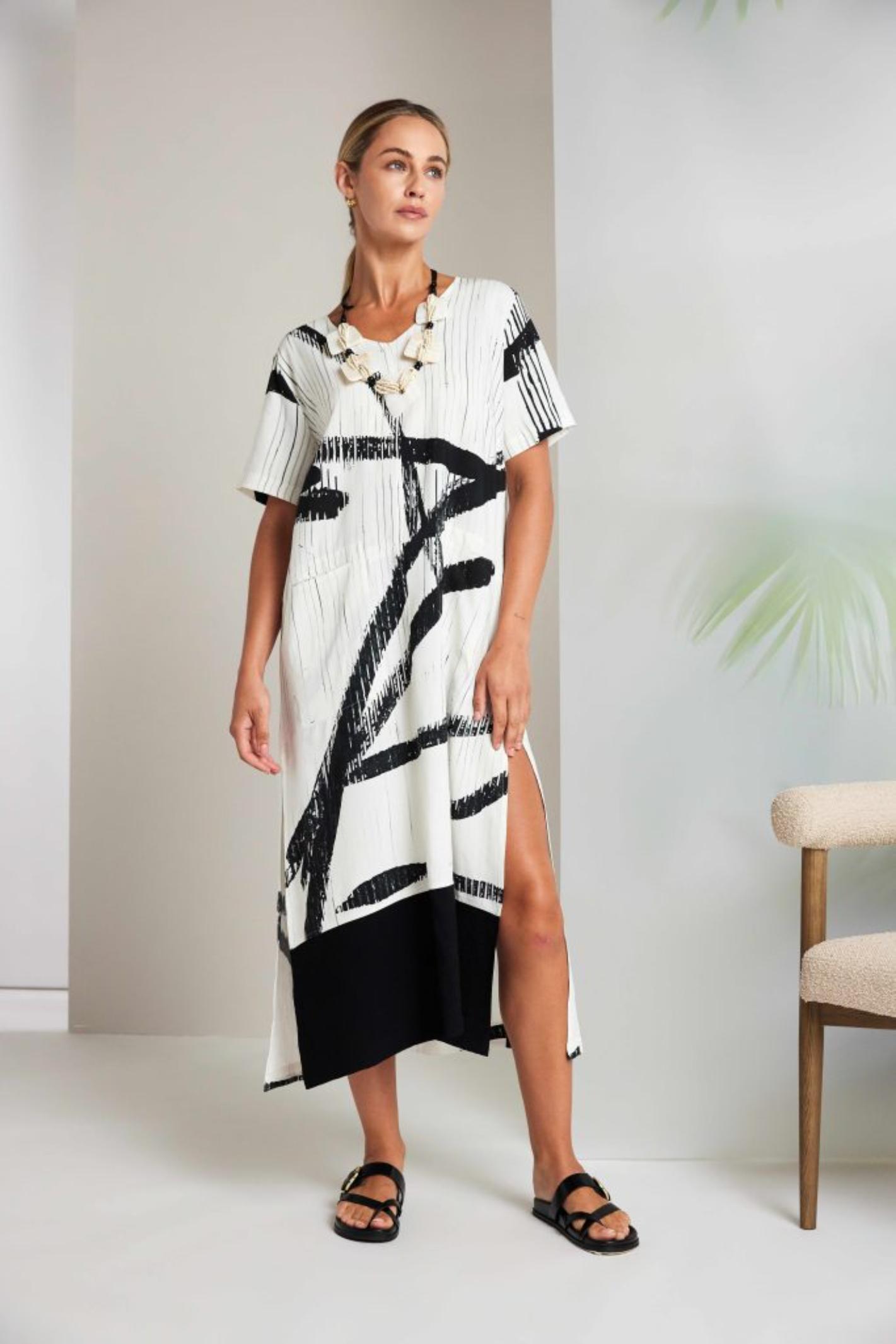 Naya NAS26320 Cream Black Brush Stroke Dress by Naya shown on model, shop Naya styles at Dotique for bold artistic fashion.