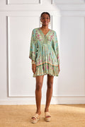 Model wearing NKN Nekane Gaia Aqua Short Viscose Dress with Botanical Print and Japanese Sleeves by nkn nekane, shop Dotique