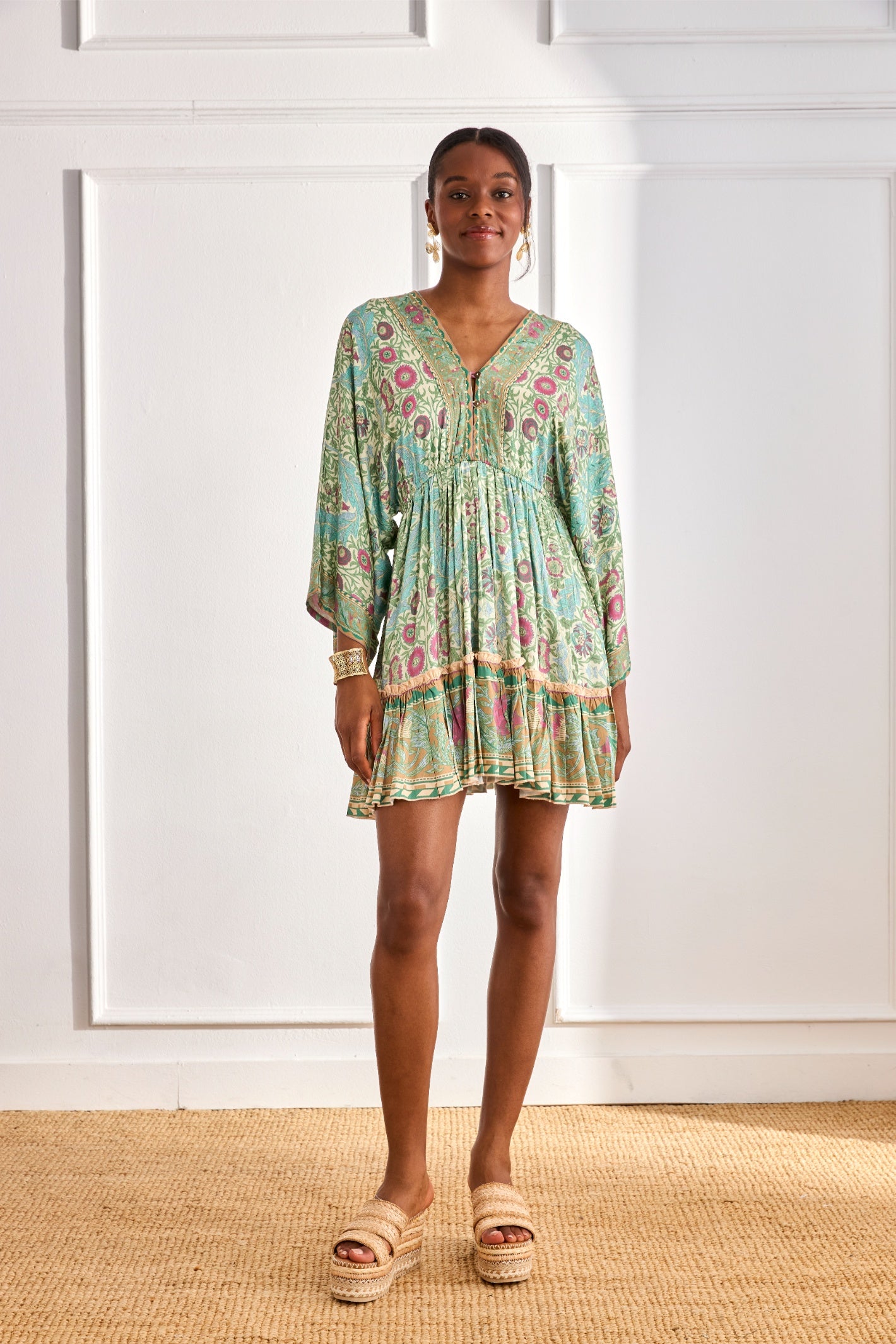 Model wearing NKN Nekane Gaia Aqua Short Viscose Dress with Botanical Print and Japanese Sleeves by nkn nekane, shop Dotique