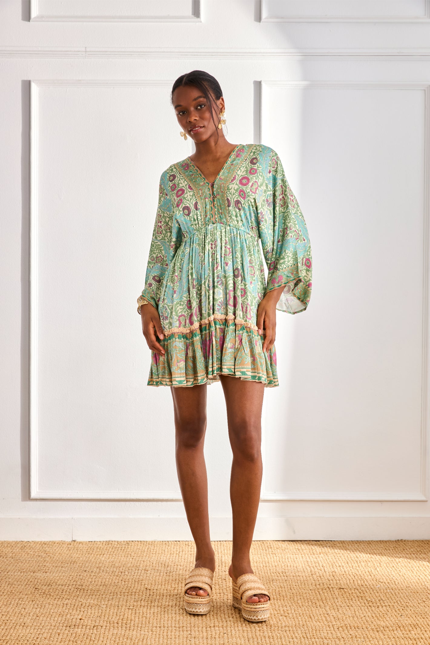 Model wearing NKN Nekane Gaia Aqua Short Viscose Dress with Botanical Print and Japanese Sleeves by nkn nekane, shop Dotique