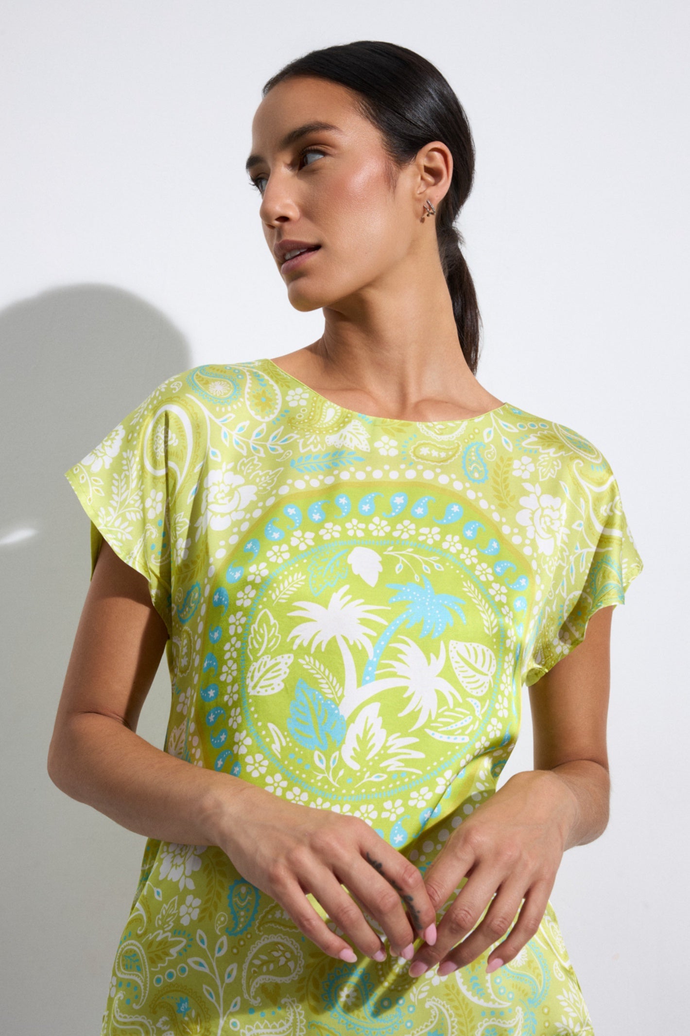 Model wearing Tinta 39636107 Nelida Lime T -Shirt with floral and paisley patterns by tinta, shop tinta at Dotique