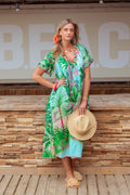 Model showcasing Place Du Soleil Green Jungle Print Dress S26-411 by Place du Soleil shop Dotique with tropical accessories