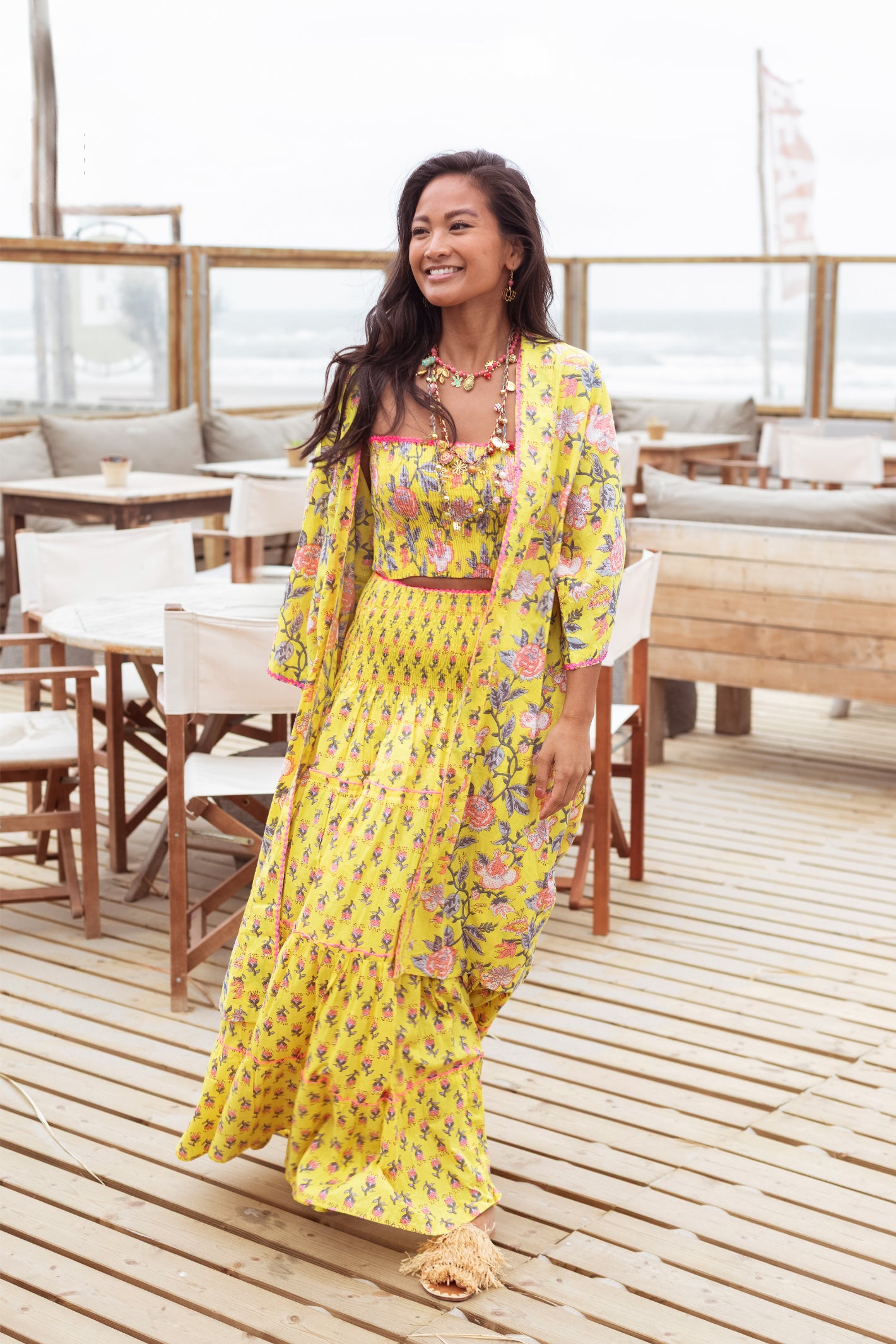 Model wearing Place Du Soleil Yellow Flower Print Long Skirt S26-413 by Place du Soleil, shop Place du Soleil at Dotique