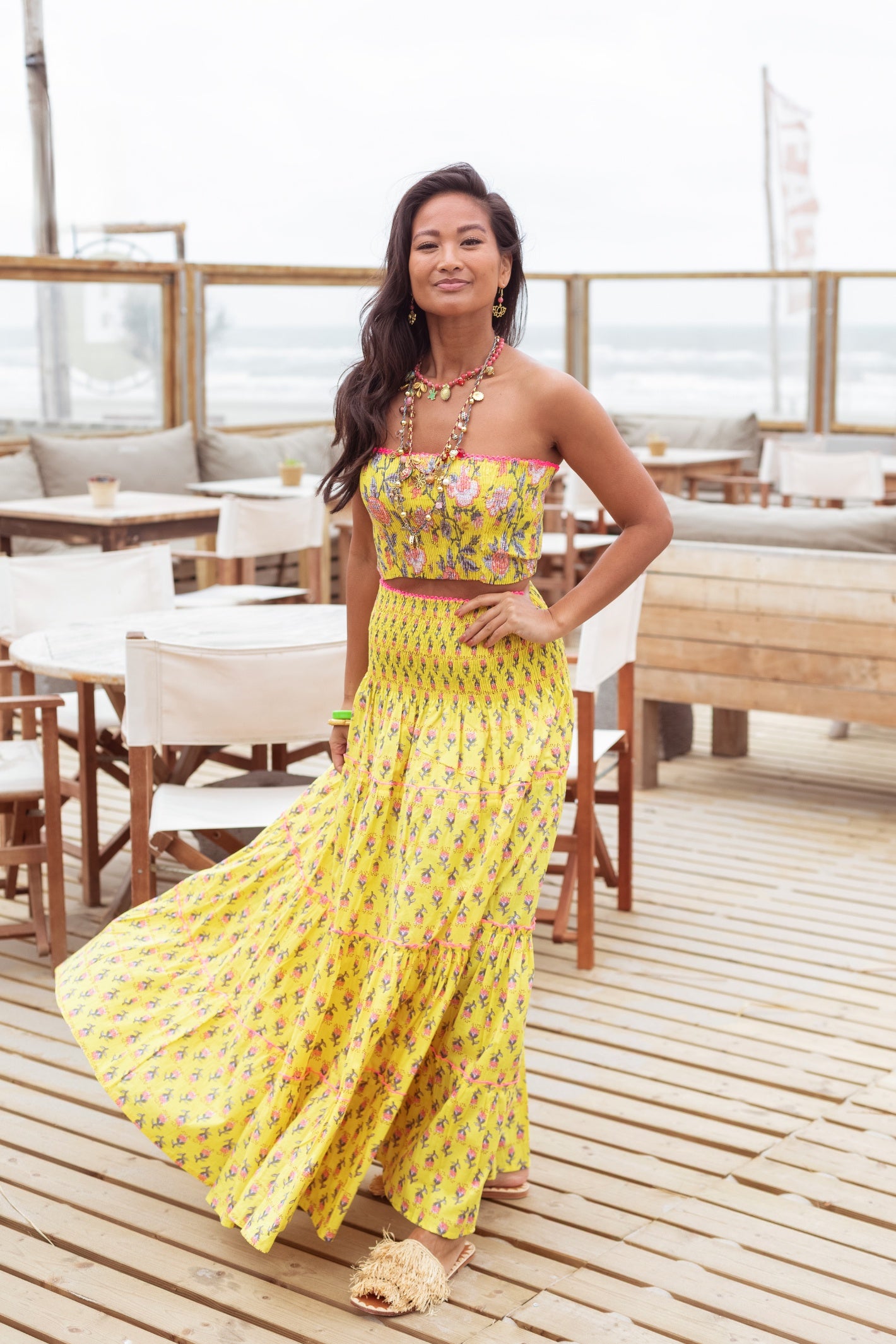 Model showcasing Place Du Soleil Yellow Flower Print Long Skirt S26-413 by Place du Soleil, shop Place du Soleil at Dotique