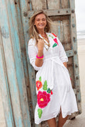 Model wearing Place Du Soleil White Long Dress With Large Embroidered Flower S26-338 by Place du Soleil, shop Place du Soleil at Dotique