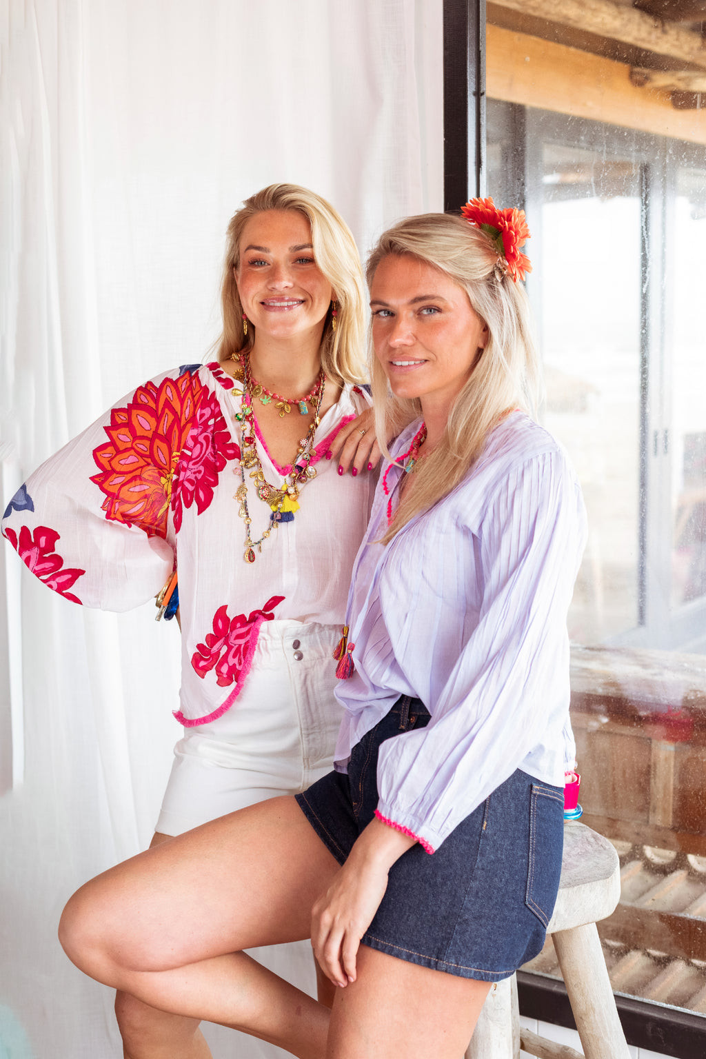 Model wearing Place Du Soleil White Blouse With Large Flower Print Long Sleeves S26-425 by Place du Soleil, shop Place du Soleil at Dotique