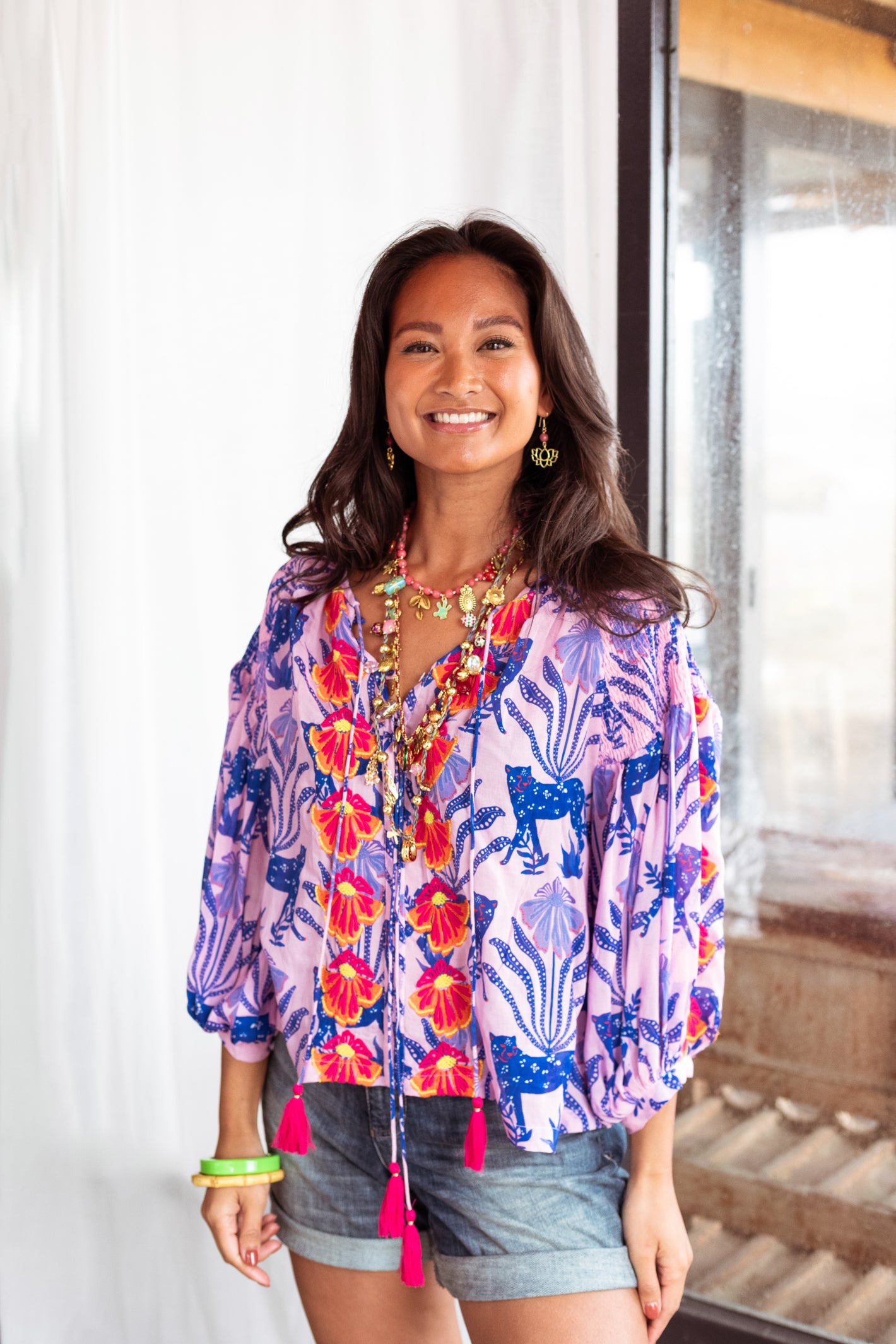 Model wearing Place Du Soleil Blue Tiger Embroidered Blouse S26-334 by Place du Soleil shop Dotique styled with colorful accessories