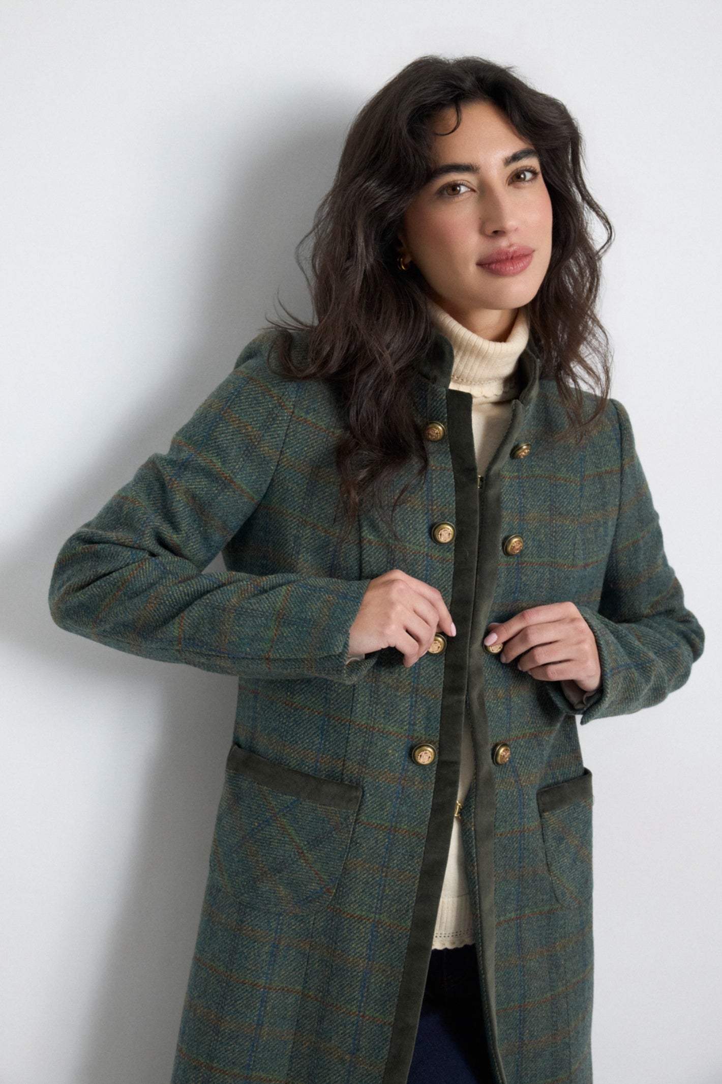 Shop the Bariloche 4045106 Porensa Women's Coat in Dark Green at Dotique. A timeless check coat with luxurious velvet trim, gold-tone buttons and elegant tailoring for the cooler seasons.