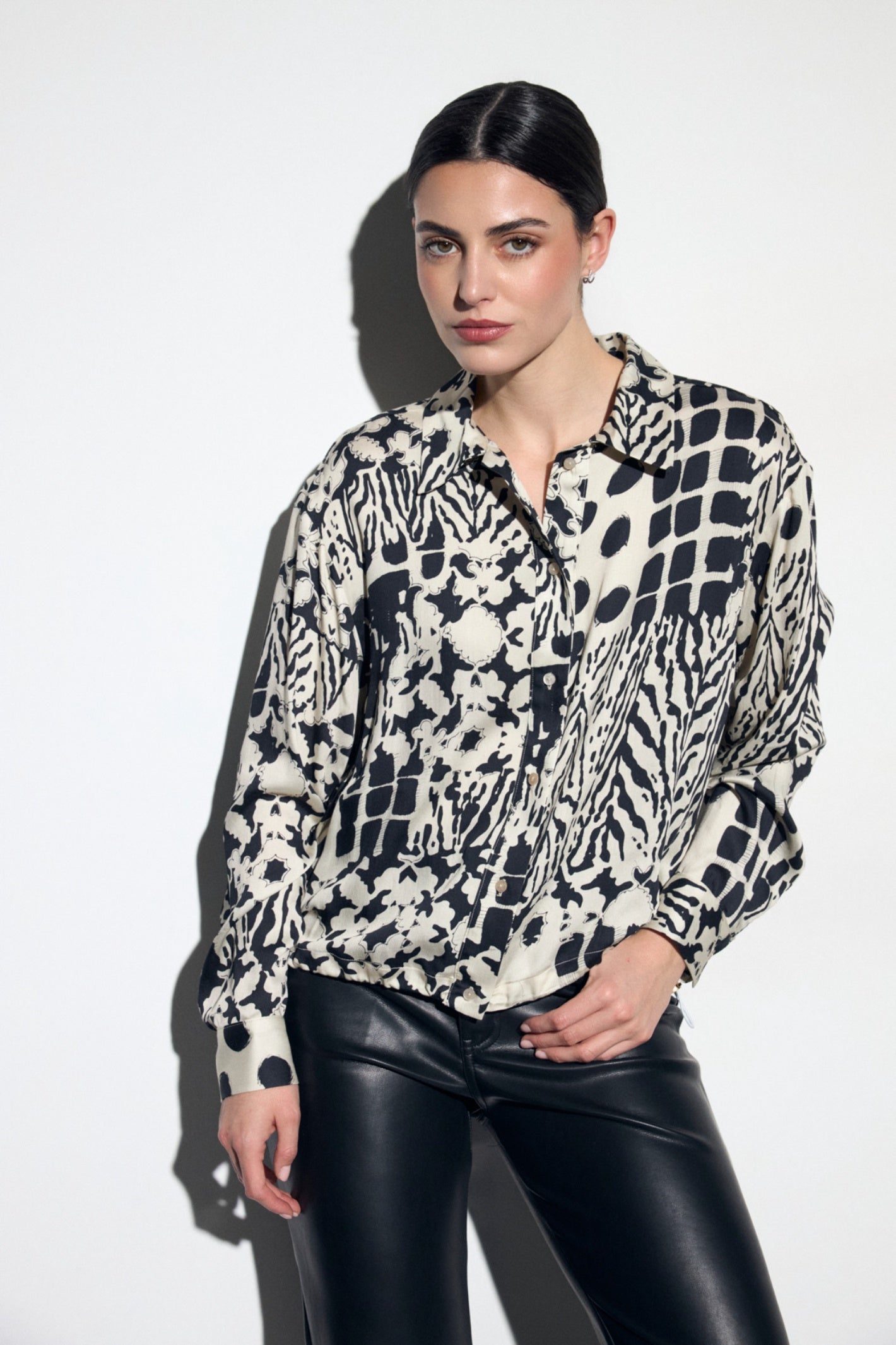 Shop the Tinta 4027702 Ronalda Women's Shirt in Black at Dotique. A relaxed-fit printed shirt with a striking monochrome patchwork design, perfect for effortless everyday and occasion styling.