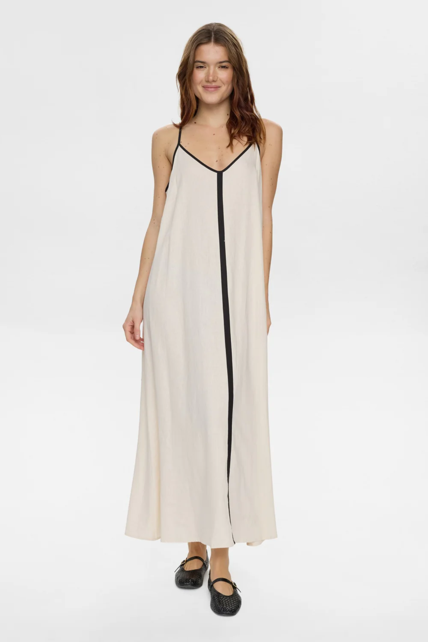 Model wearing Numph 706765 Nualani Dress Whitecap Gray with black trim and thin straps by Numph. Shop Numph at Dotique.