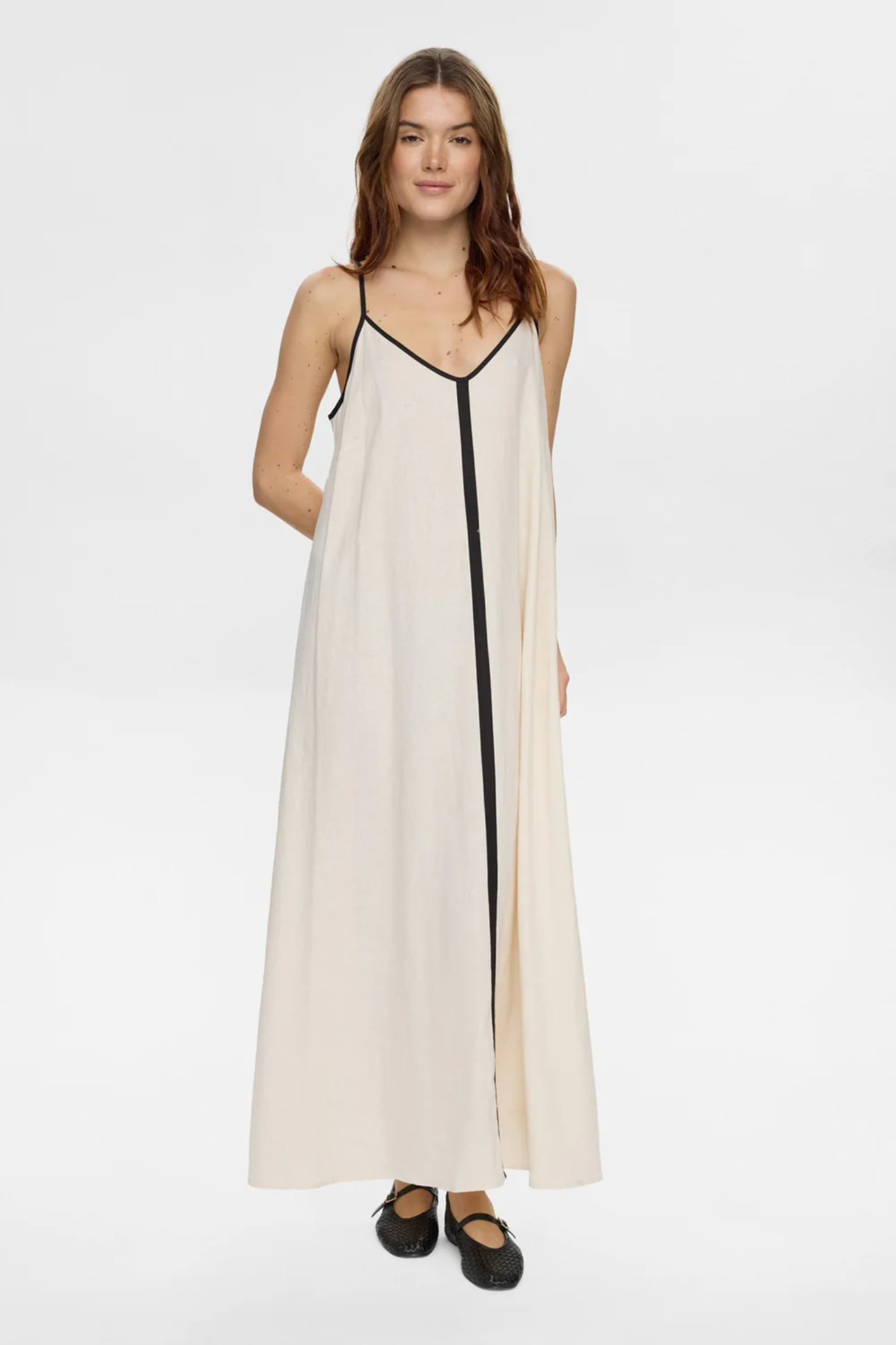 Model wearing Numph 706765 Nualani Dress Whitecap Gray with black trim and thin straps by Numph. Shop Numph at Dotique.