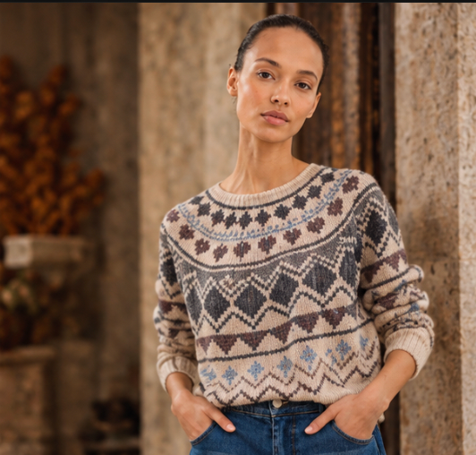 Woman wearing a patterned knit sweater and jeans lululemon at Dotique