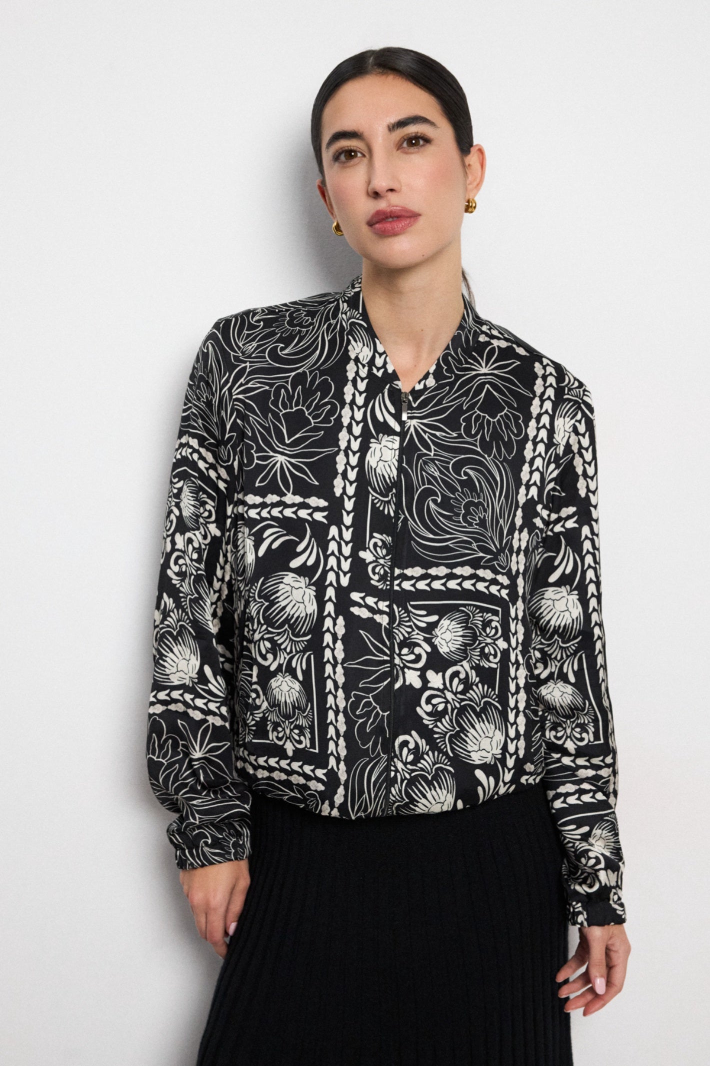 Shop the Bariloche 4011102 Vada Women's Shirt in Black at Dotique. A lightweight zip-front blouse with an elegant ivory floral print, perfect for effortless everyday and occasion styling.