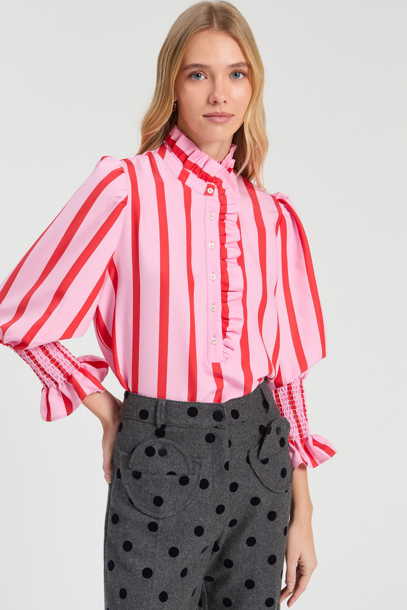 Shop the Vilagallo Pink & Red Striped Ruffle Shirt at Dotique. Made from a lightweight viscose blend with a frilled neckline, shirred cuffs and bold striped design.