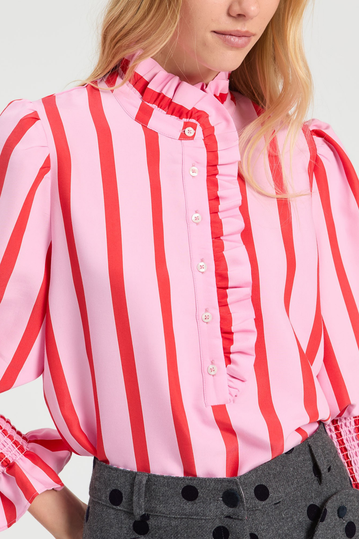Shop the Vilagallo Pink & Red Striped Ruffle Shirt at Dotique. Made from a lightweight viscose blend with a frilled neckline, shirred cuffs and bold striped design.